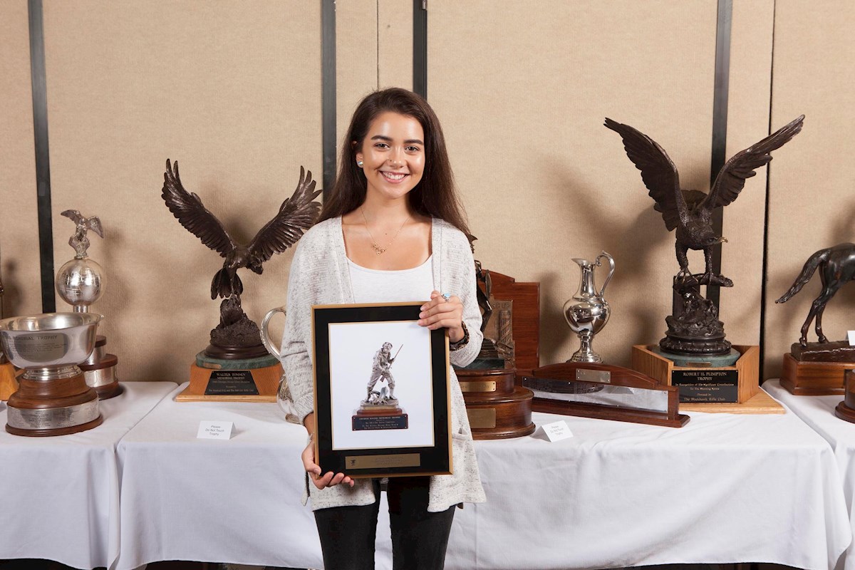 University of Kentucky bound Ruby Gomes displays the Charlie Rogers Trophy plaque, emblematic of the national  Expert class prone champion which she won at 2017 at the National Smallbore Rifle Prone Championships. Photo credit NRA